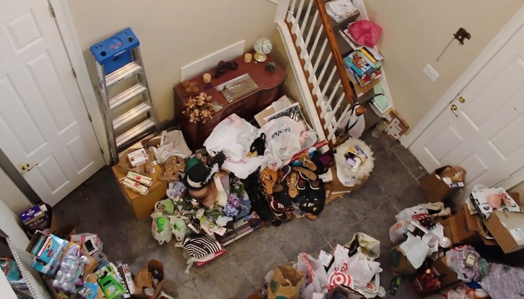 Compassionate cleanup crew organizing and clearing a cluttered US home with care